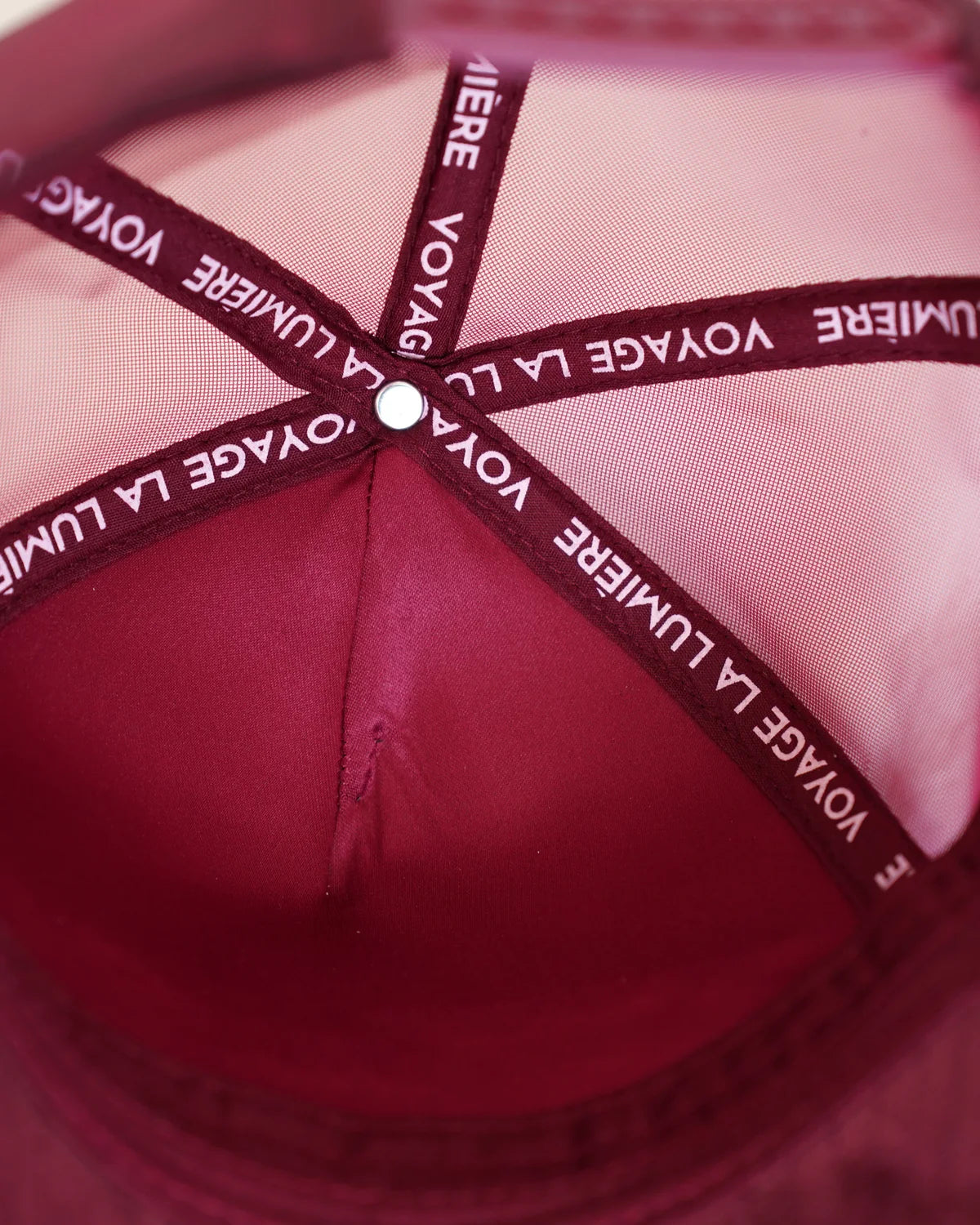 Inside Le Rouge-de-Cuivre: the lining, the house name taped along every seam.