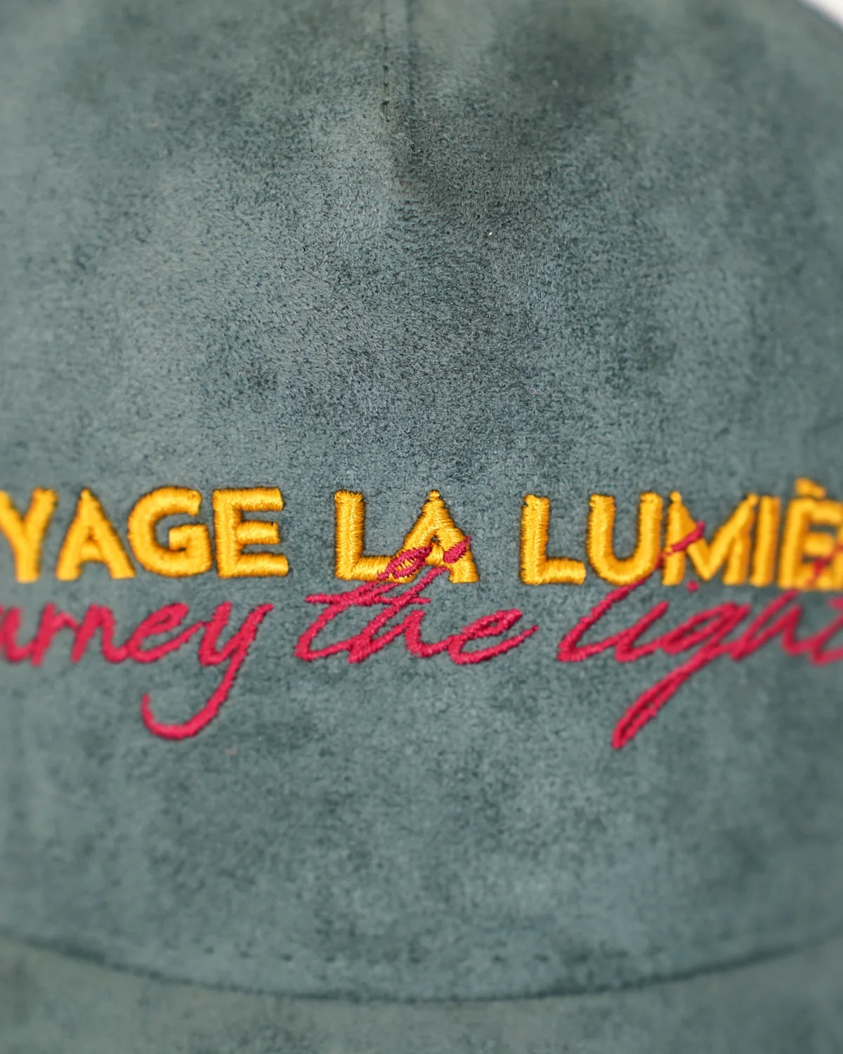 Le Vert-de-Grèce, the embroidery close: the house name raised, the script beneath it.